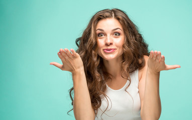 Portrait of young woman with shocked facial expression