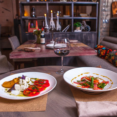 two plates with vegetarian salads on the table in the restaurant