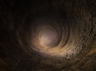 The hole of an ancient stone well