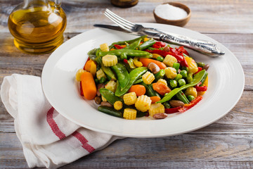 Stir fry vegetables on white plate. Copy space