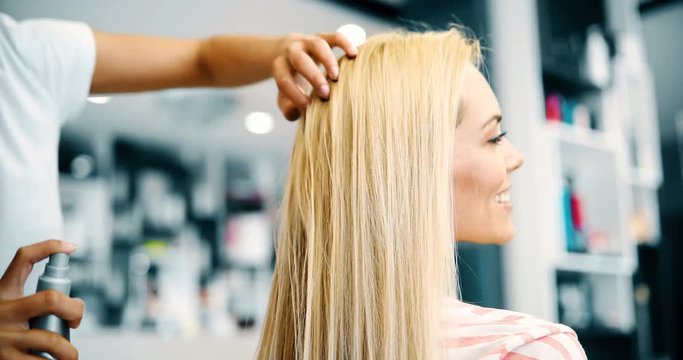 Portrait of hairdresser taking care of blonde woman