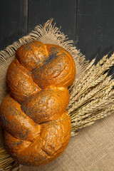 fresh bread and wheat on the wooden