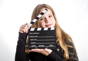 Teenage girl with clapperboard