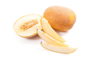 Whole, half and sliced honeydew melon tropical fruit isolated on a white background.