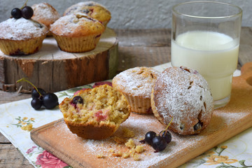 Oat Muffins with black currant on a cutting wooden background. Homemade baking. Healthy food.