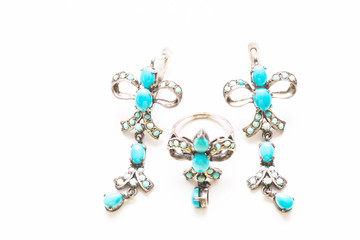 Earrings and a ring with turquoise in the form of a bow