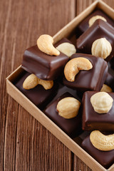 Fototapeta na wymiar Handmade chocolate bonbons with hazelnut