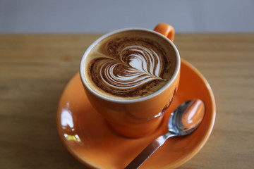 cappuccino coffee on wood background