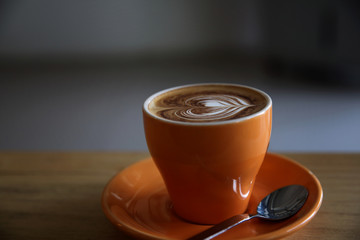 cappuccino coffee on wood background