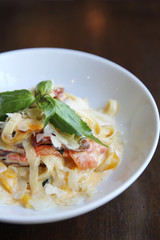 Chorizo sausage spaghetti fettuccine on wood background