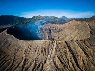 Mountain Bromo active volcano crater in East Jawa, Indonesia. Top view from drone fly - obrazy, fototapety, plakaty