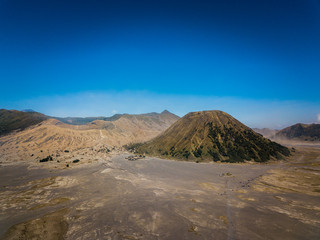 Fototapeta na wymiar Mountain Bromo active volcano crater in East Jawa, Indonesia. Top view from drone fly