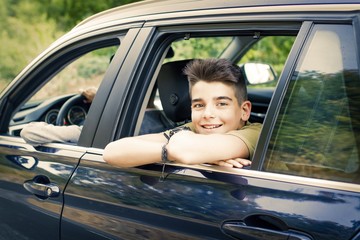 child in the car window