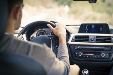 young man in the car