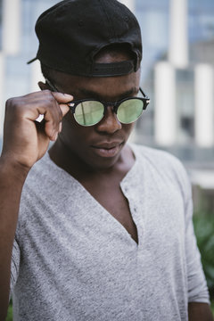 attractive black young man wearing sun glasses