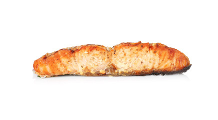 Slice of delicious fried salmon on white background