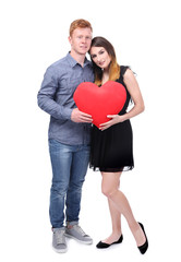 Fototapeta na wymiar Lovely couple holding red heart on white background