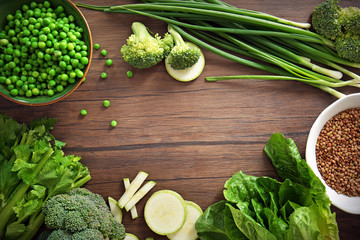 Ingredients for kale soup on wooden background