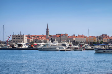 Fototapeta premium White yacht in harbor of small city
