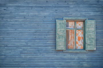 Wall of wooden house with window
