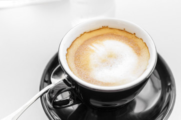 Coffee in a black cup.