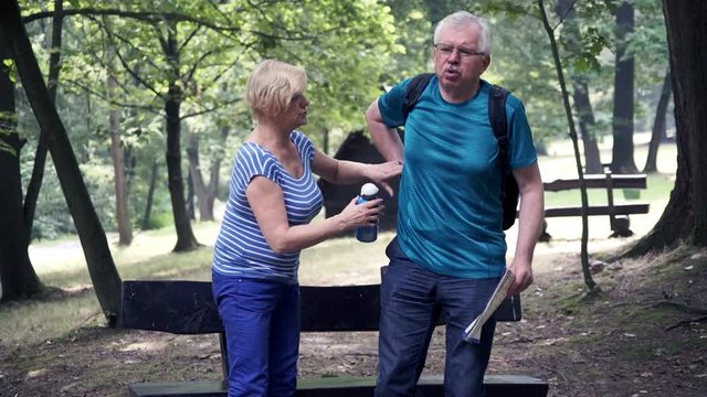 mature man having backbon pain during weekend trip 
