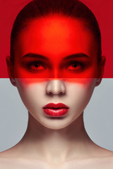 Pure perfect skin and natural makeup, skin care, natural cosmetics. Long eyelashes and big eyes, red film on face. Beautiful attractive Nude woman. Fashion art photo. Natural makeup on a girl's face
