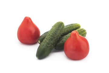 Tomatoes and cucumbers on a white background