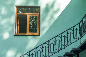 Obraz premium fasade of a house window and metal ladder