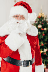 santa claus with hush sign