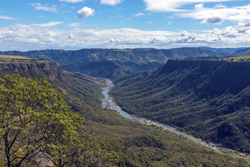Unzimkulwana River Flowing Through Winter Vegatation Lined Valley