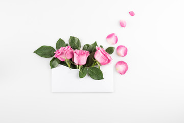 pink roses in envelope