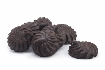chocolate covered marshmallows, part of one bitten off, isolated on white background