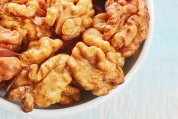Close up picture of walnuts in a bowl, shallow depth of field.