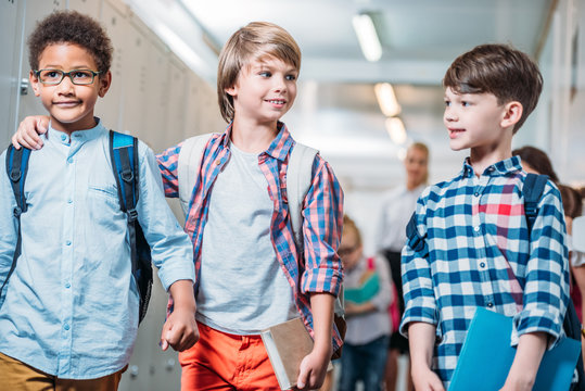 schoolboys walking by school corridor