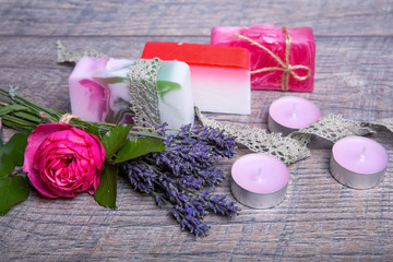 Obraz na płótnie Canvas Handmade Soap with bath and spa accessories. Dried lavender and nostalgic pink rose