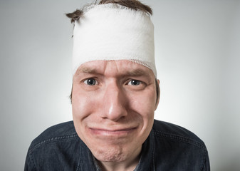 Man with bandage on his head