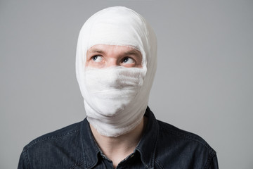 Man with bandage on his head