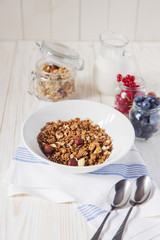 healthy breakfast homemade baked granola or muesli with fresh blueberries white background