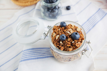 healthy breakfast homemade baked granola or muesli with fresh blueberries white background