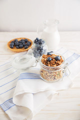 healthy breakfast homemade baked granola or muesli with fresh blueberries white background
