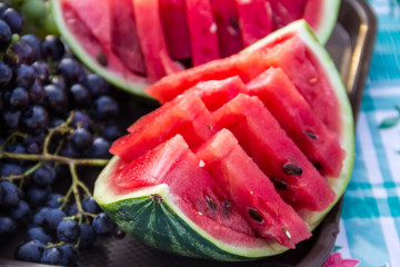 Ripe fresh sliced watermelon on a table
