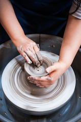 Hands making pottery art, clay work