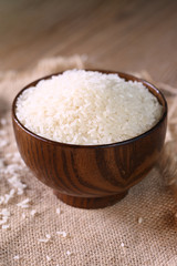 Close up of white rice in the wooden bowl. 