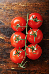 Cherry tomatoes on a wooden background