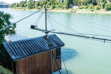 small boat house on rhine river with water