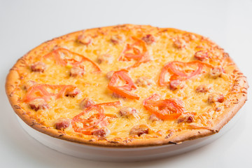Homemade round classic russian pizza on a table