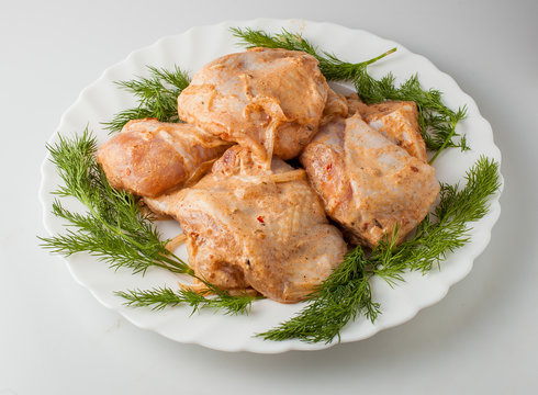 Raw marinade chicken wings with greens. Meat