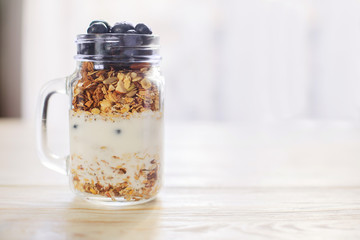 healthy breakfast homemade baked granola or muesli with fresh blueberries white background