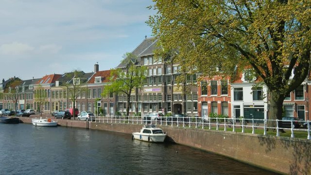 Boats, houses in canal. Harlem, Netherlands